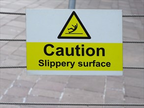 Caution slippery surface sign