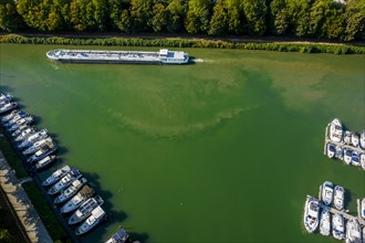 Drone shot of the Rhine-Herne Canal with cargo ship and sports boats