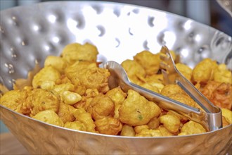 Pakora is a dish consisting of pieces of vegetable or meat that are dipped in a spiced batter and deep-fried