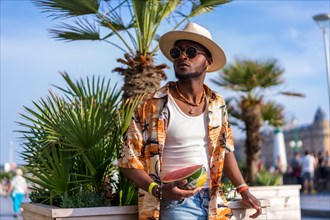 Black ethnic man enjoy summer vacation on the beach
