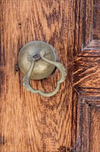 Old Handmade ottoman door knob on wood