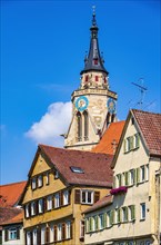 Tower of the collegiate church and parts of the historic house front on the Neckar