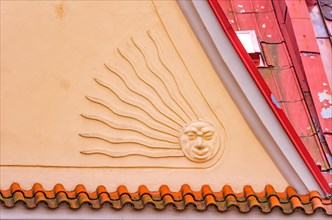 Sun symbol on a historic house gable on the market square of Sobotka near Jicin