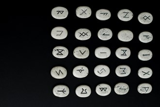All viking stone runes on a black background fortune teller nordic mythology
