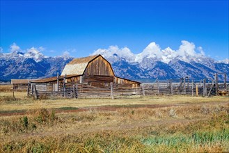 Old farm in the countryside by the rocky mountain at Grand Teton National Park in autumn