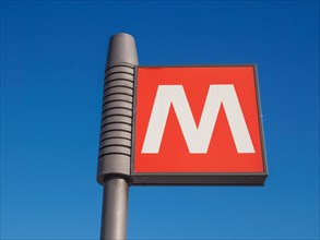 Subway sign over blue sky