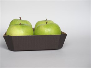 Granny Smith apple fruit food in cardboard basket