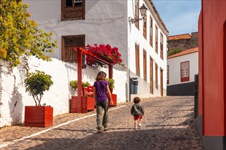 Mother and son visiting the village of Agulo in the north of La Gomera on vacation