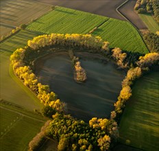 Aerial view of a lake in the shape of a heart north of Luenen