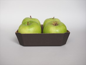 Granny Smith apple fruit food in cardboard basket