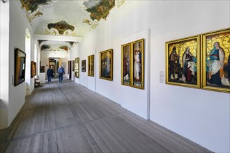 Long corridor with ceiling fresco and paintings