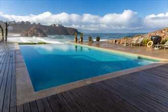 Infinity swimming pool overlooking Atlantic Ocean