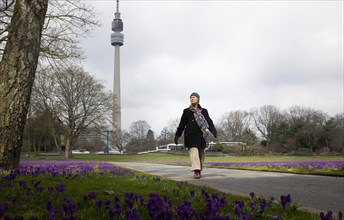 Subject: Woman walking. Woman walking in the Westfalenpark in Dortmund