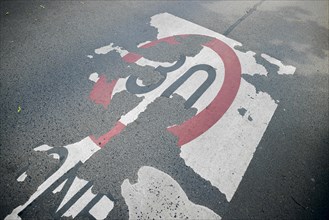 A weathered lettering for a speed 30 zone