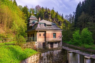 Old hydroelectric power plant power station from 1926 on the Rieger Trail in the valley of the Jizera River near Bitouchov