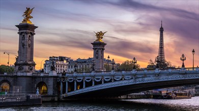 Evening atmosphere in the Seine in Paris with Pont Alexandre III bridge and Eiffel Tower