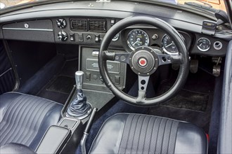 Steering wheel and dashboard of a classic 1972 MG MGB Roadster sports car