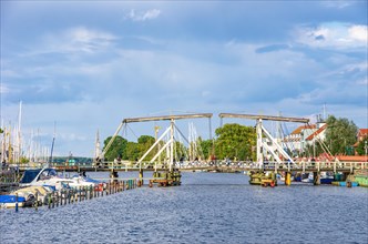 Picturesque view of the old Wieck wooden bascule bridge over the river Ryck
