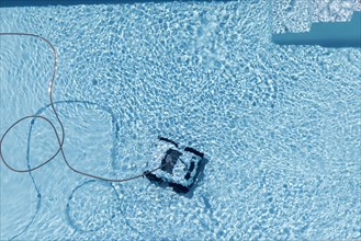 Cleaning robot in a swimming pool