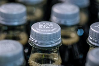 New bottle cap on a Coca-Cola bottle. New EU directive. The cap must stay on the bottle