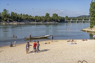 Bathing place on the beach of the Rhine at the Birskoepfli Rhine Park in Basel