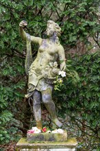 'Flora' classical sculpture female goddess figure artwork in garden