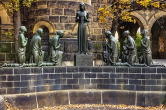 Group sculpture of the consoling Christ by Selmar Werner at the fountain in the courtyard of the Church of Reconciliation in Dresden
