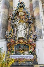 Side altar with floral decoration and saint's relic St. Bonifacius