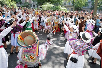 Participants entertain the crowd before the start of the Carnival of Cultures in Berlin. The event passed off in glorious sunshine this afternoon as Berlin residents enjoyed the good Whitsun weather