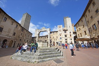 Piazza della Cisterna with the family towers