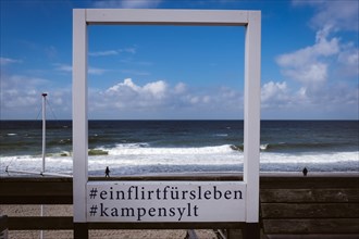 Wooden frame with view of the North Sea near Kampen on the North Sea island of Sylt