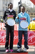 Elite mens and womens winners Tsegaye Kebede and Priscah Jeptoo at the Virgin London Marathon Medal Presentations on 21.04.2013 at The Mall
