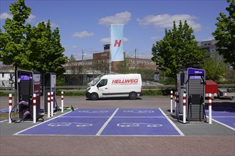Four charging stations from EnBW for electric cars in the car park of Hellweg