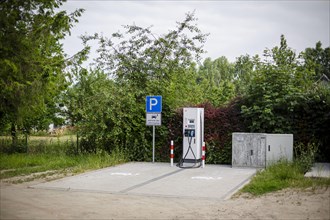 Free charging places at a charging station for electric vehicles in the green. Ummanz