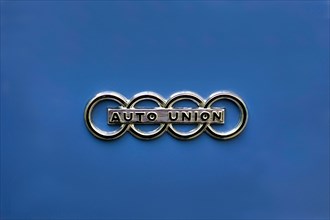 Logo of the Auto Union on a blue background