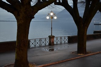 Street lamp on the waterfront at night