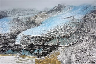 Aerial view in winter over the glacier Falljoekull