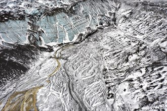 Aerial view over the glacial Virkisa River basin along the Glacier Falljoekull in winter in Austurland