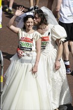 Runners in wedding fancy dress at the Virgin London Marathon Finish on 21.04.2013 at The Mall