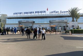 People outside airport terminal building
