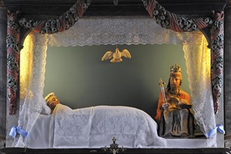Interior of the chapel chapelle de la Vierge couchee with the sleeping Virgin Mary in bed