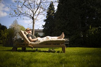 Subject: Relaxation on a lounger in the spring.