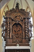 Altar with wooden retable in the Saint-Sebastien chapel at Dambach-la-Ville