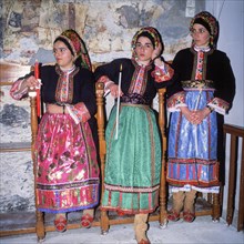 Women in traditional traditional costume during Easter mass