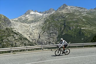Cyclists on the descent from the Furka Pass