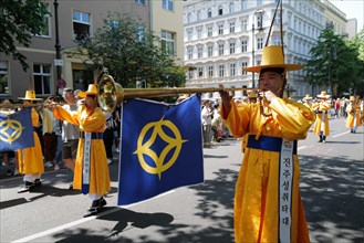 Korean participants entertain the crowd before the start of the Carnival of Cultures in Berlin. The event passed off in glorious sunshine this afternoon as Berlin residents enjoyed the good Whitsun we...