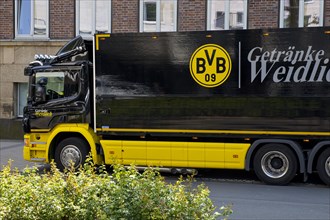 Black and yellow truck with drinks with Borussia Dortmund club emblem