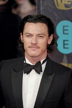 Red Carpet Arrivals at the EE British Academy Film Awards. Persons Pictured: Luke Evans
