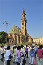 Chinese tourists in front of the Gothic cathedral