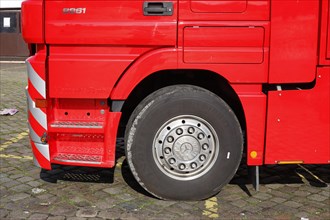 Wheel and tyre on a red Mercedes truck
